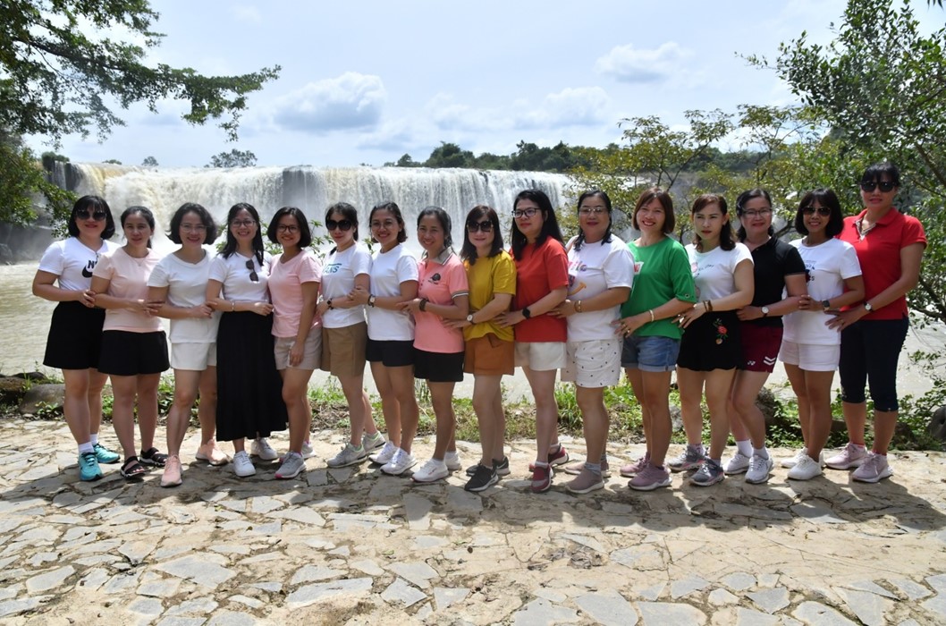 A group of people posing for a photoDescription automatically generated