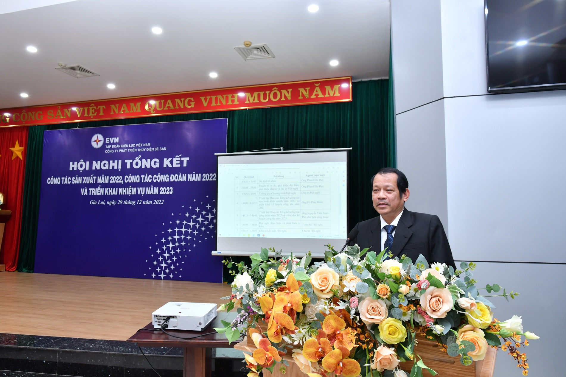 A person standing at a podiumDescription automatically generated with low confidence