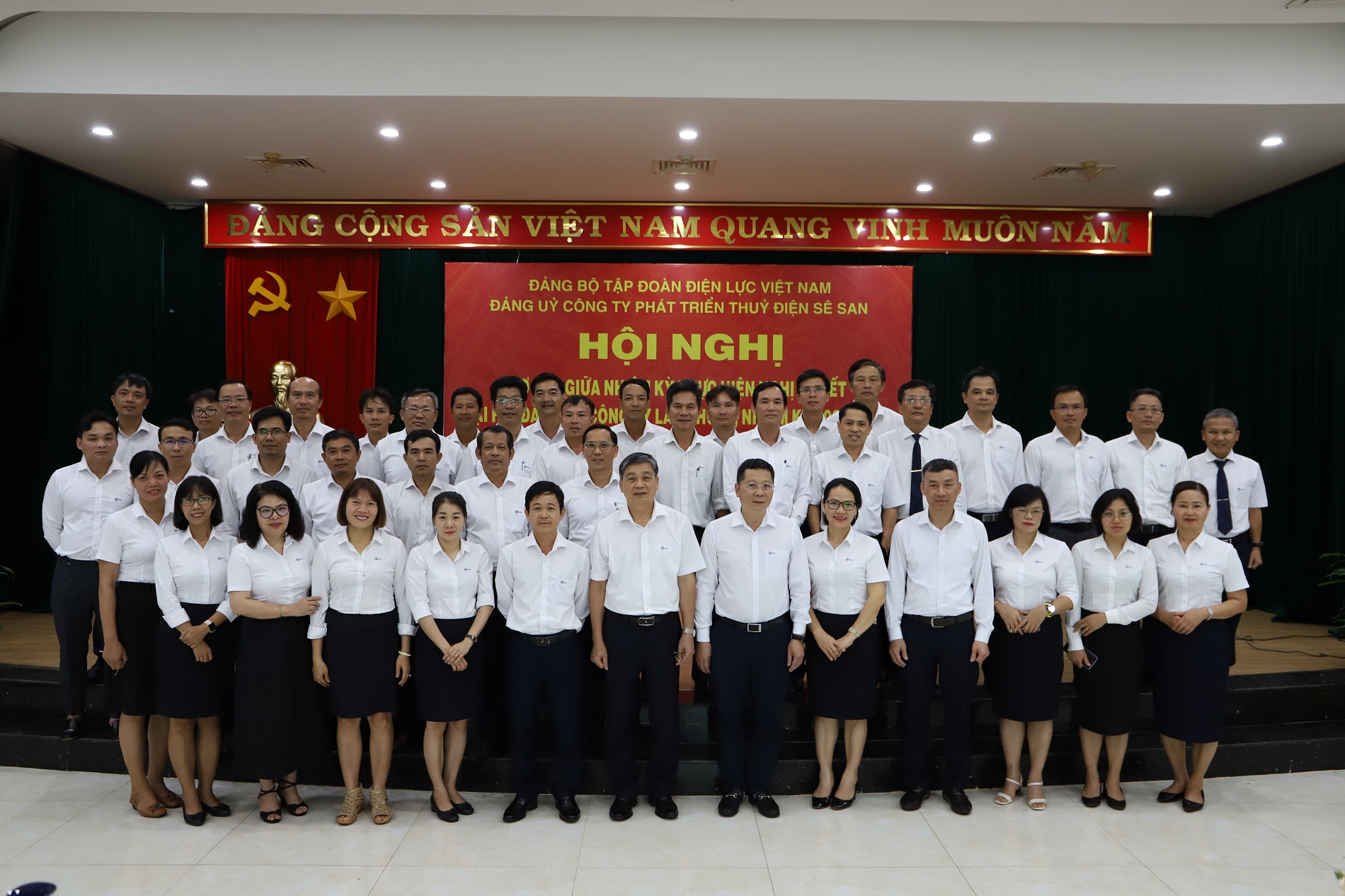 A group of people in white shirts and black skirtsDescription automatically generated with medium confidence