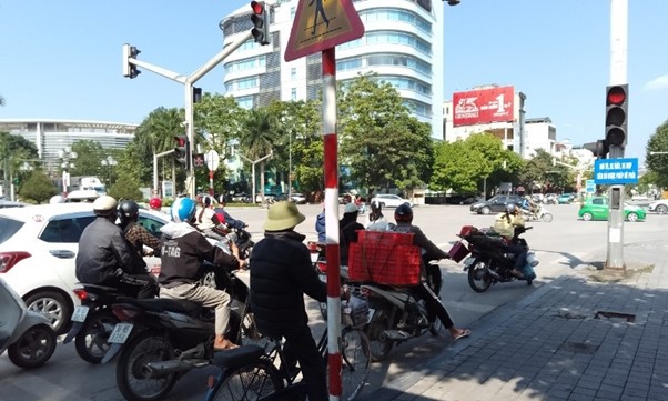 A group of people on motorcycles on a streetDescription automatically generated